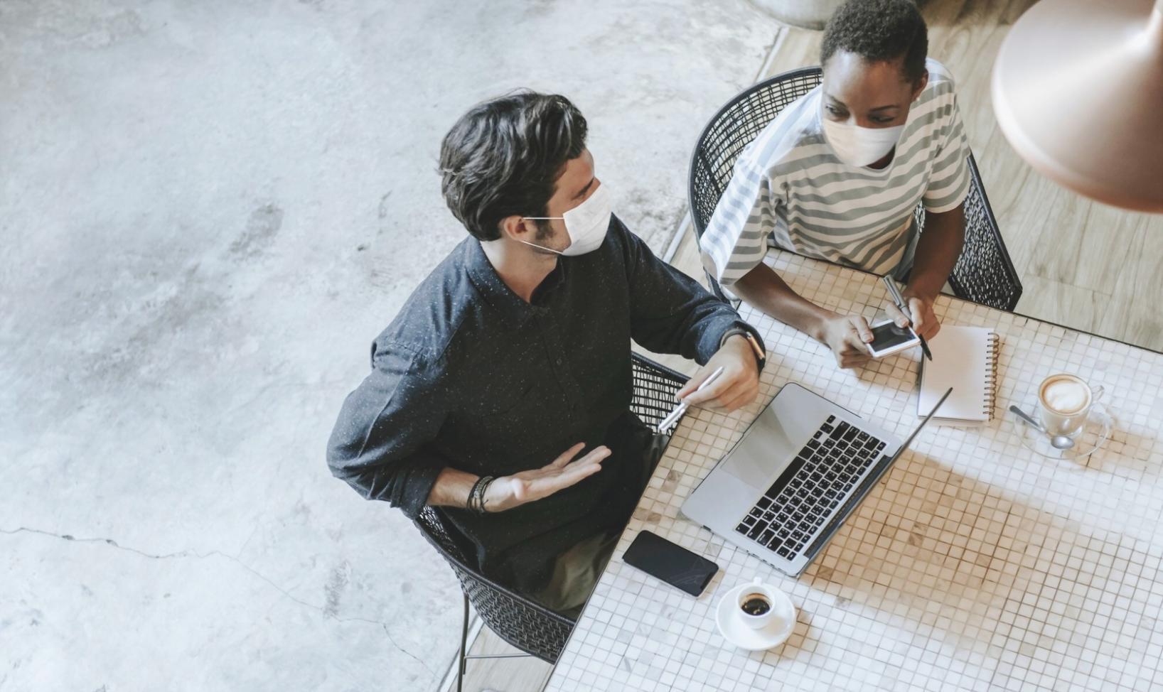 Team meeting discussing departmental resource allocation and budget planning strategies