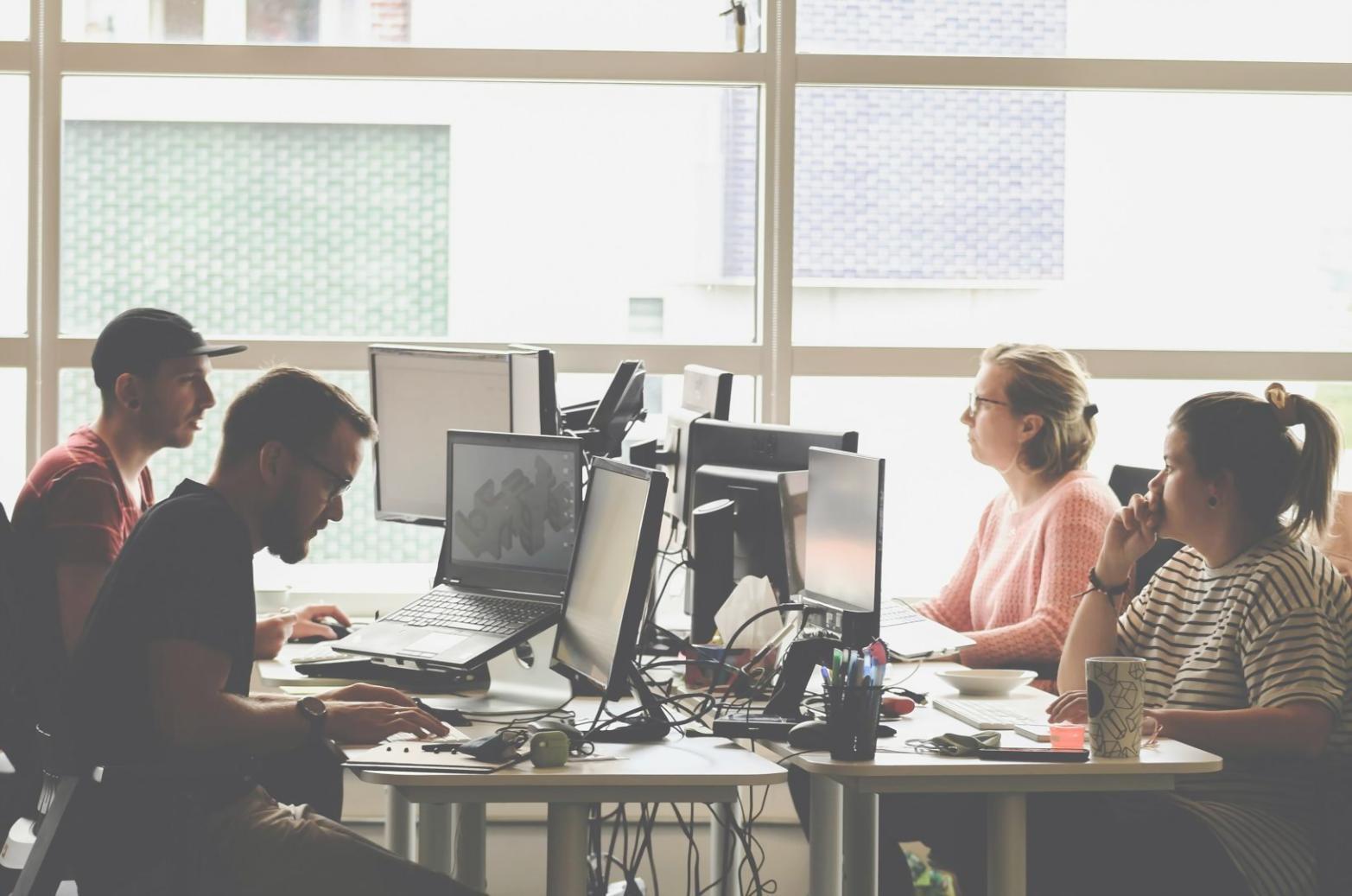 Interactive workshop setting with participants collaborating on departmental budget analysis